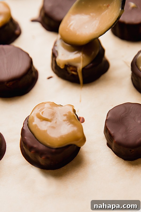 Close-up shot of chocolate-covered banana bites with rich dairy-free caramel being artistically drizzled over them.