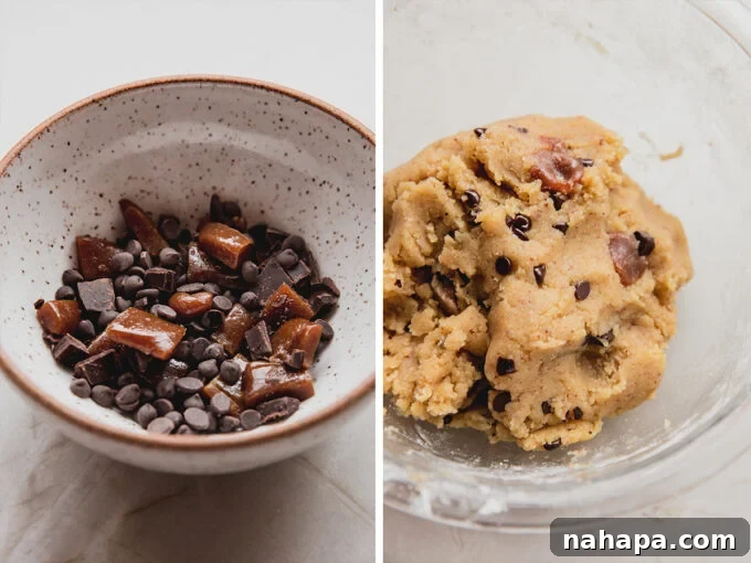 Close-up of golden cookie dough infused with chunks of chocolate chips and gooey caramel.