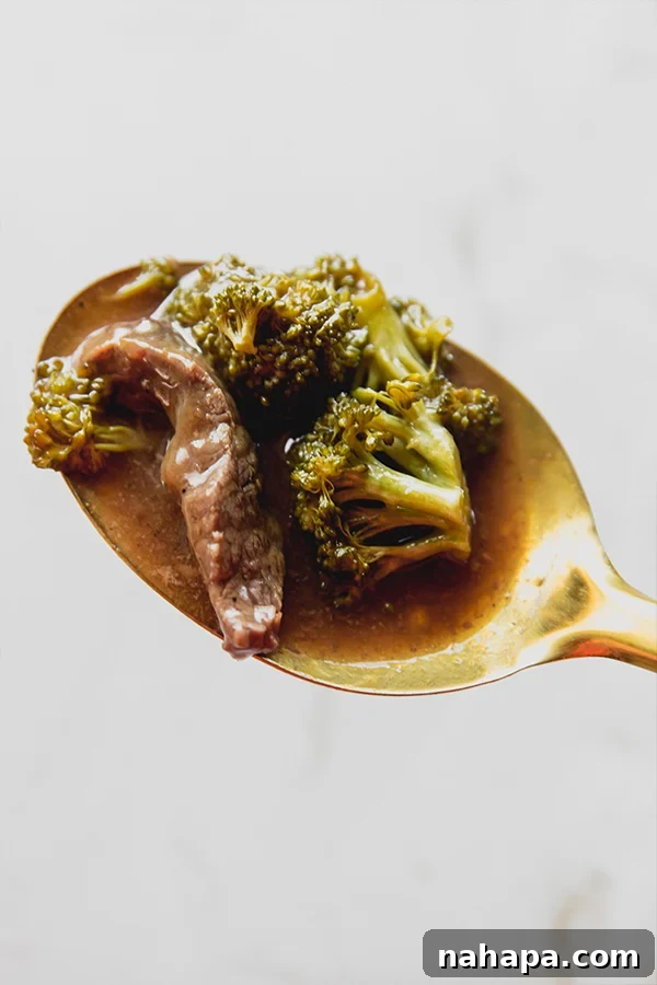Savory Citrus Beef Slow Cooked Gluten Free AIP Friendly 4 Orange beef and broccoli cooking in a slow cooker
