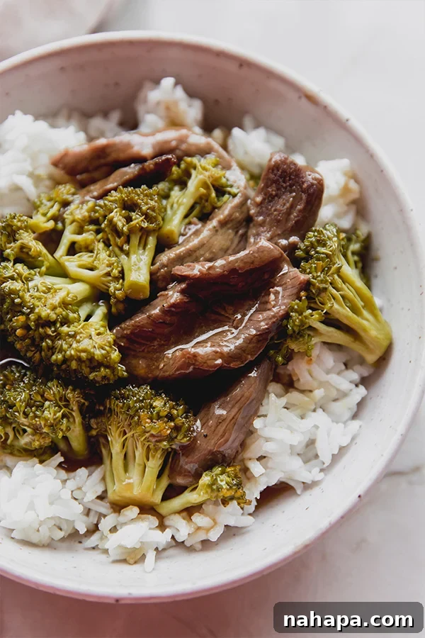 Savory Citrus Beef Slow Cooked Gluten Free AIP Friendly 6 Slow Cooker Orange Beef served on a plate with broccoli and rice