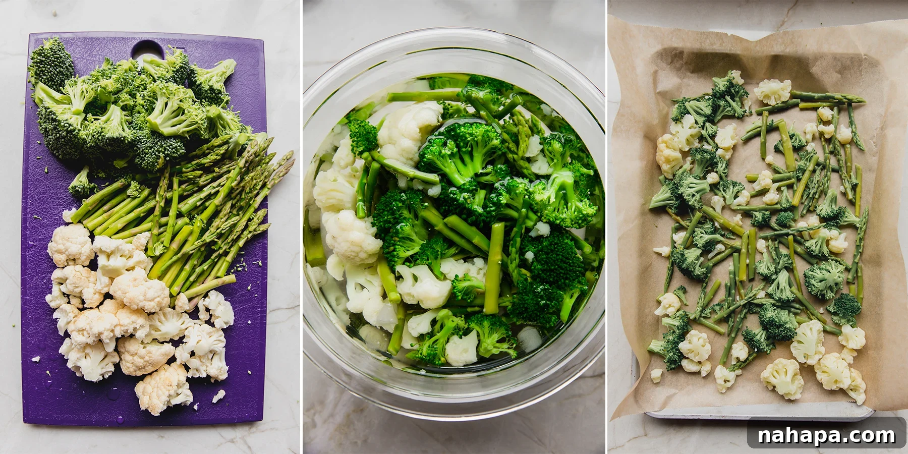 Various blanched and chopped vegetables, including broccoli, cauliflower, carrots, and sweet potatoes, laid out on a baking sheet before freezing.