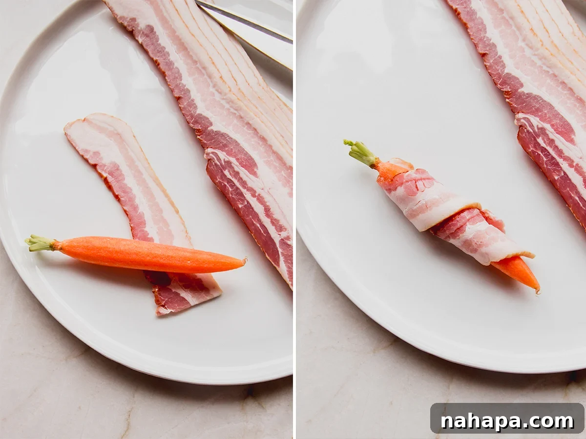 Bacon-wrapped carrots neatly arranged on a parchment-lined baking sheet, ready for the oven.
