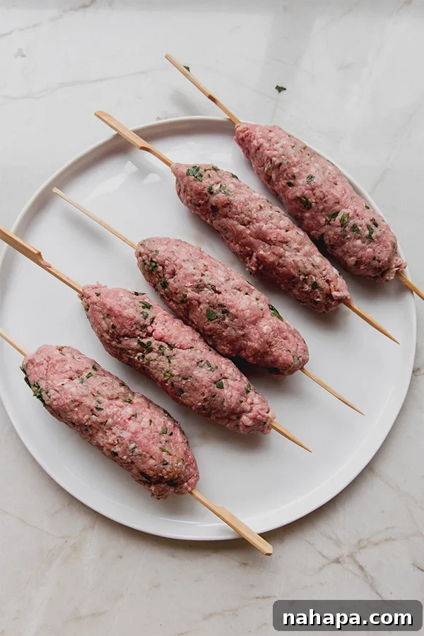 Forming Beef Kofta onto Wooden Skewers