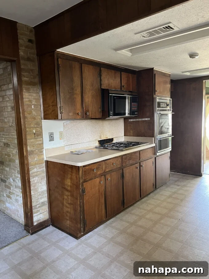 Before kitchen renovation - cramped space with outdated decor