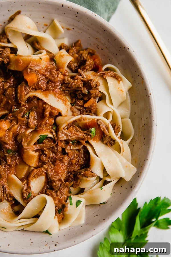 Set It and Forget It: 20+ Delicious Gluten-Free Slow Cooker Meals 6 Slow Cooker Beef Ragu served over pasta