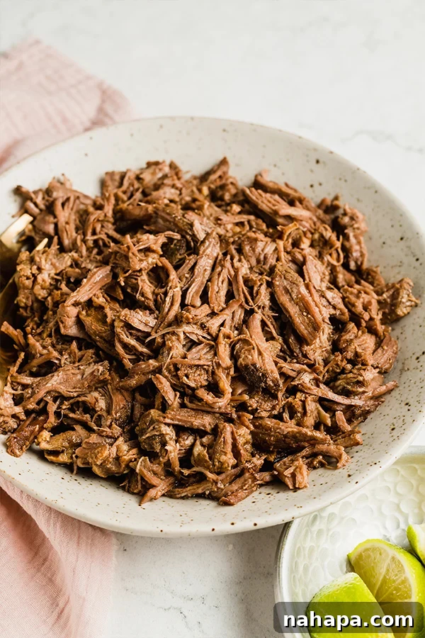 Set It and Forget It: 20+ Delicious Gluten-Free Slow Cooker Meals 9 Shredded beef in a bowl with a fork