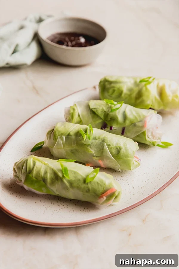 A platter of chicken and vegetable spring rolls ready on a serving platter.