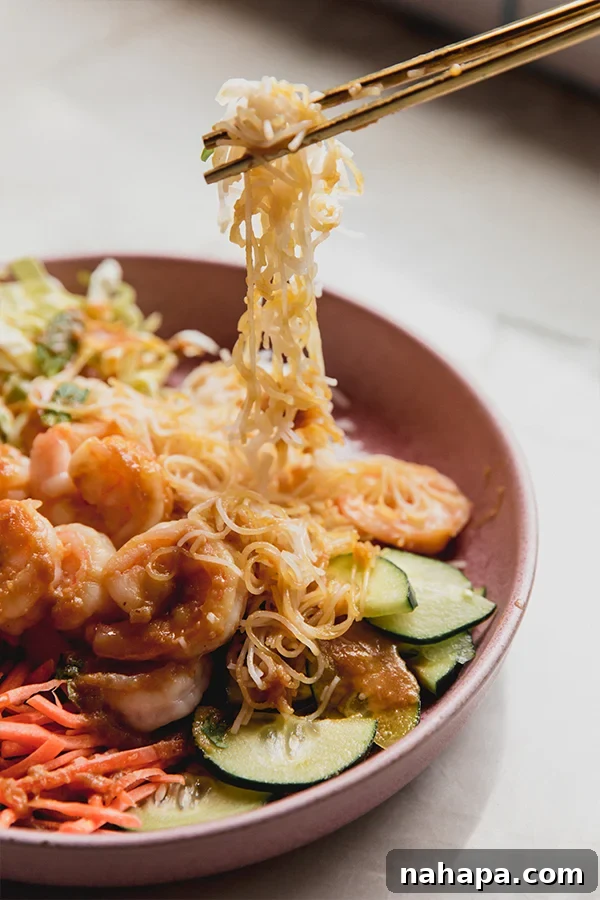 A finished spring roll bowl ready to be eaten, showcasing all the colorful ingredients
