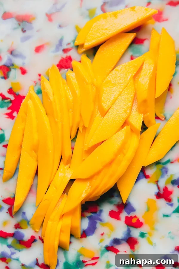 Cut up mango ready to be made into mango sticky rice rolls.