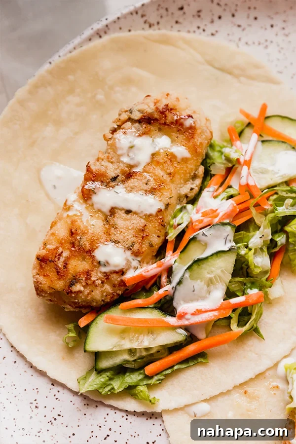 A perfectly assembled crispy chicken snack wrap.