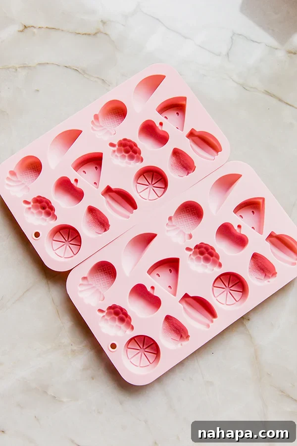 A collection of silicone molds, perfect for making homemade fruit snacks in fun shapes.