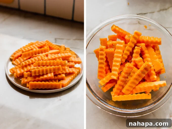 Air Fryer Crispy Zig Zag Butternut Squash Fries 4 A plate of freshly cut butternut squash fries, seasoned and ready for cooking.