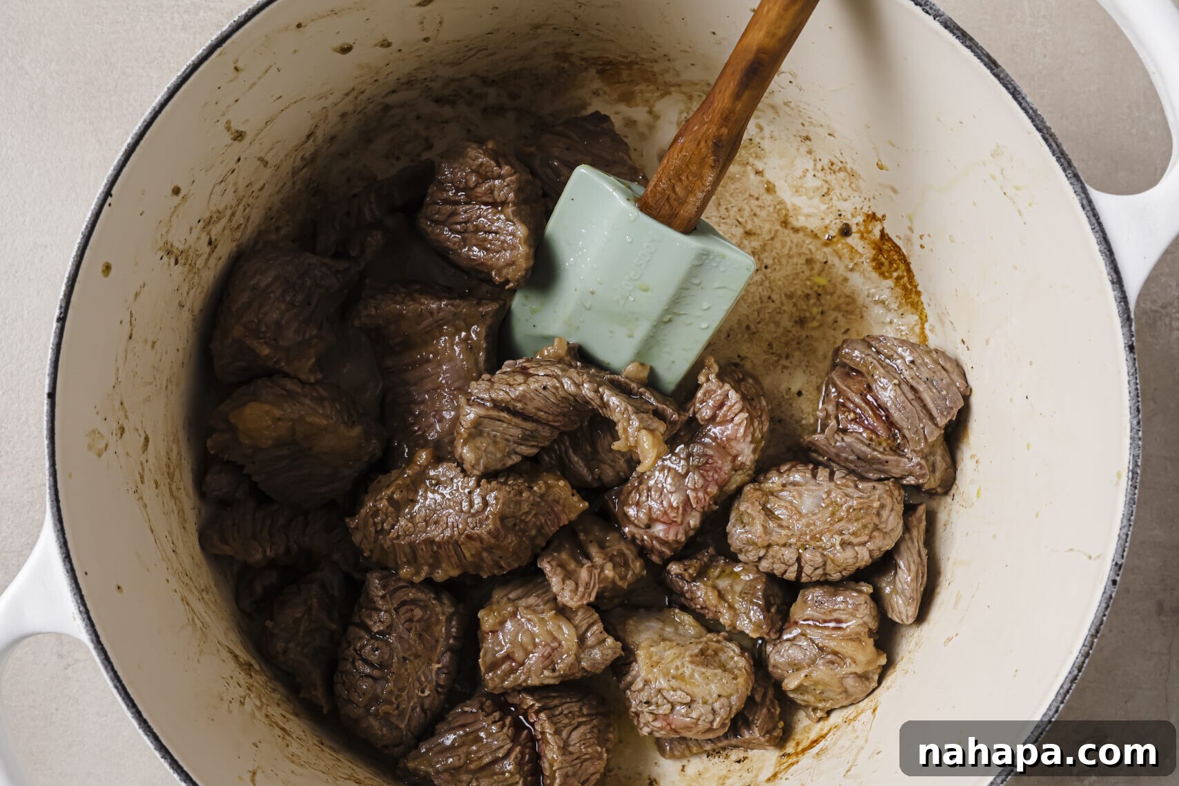 Perfectly seared beef stew meat in a Dutch oven after browning.