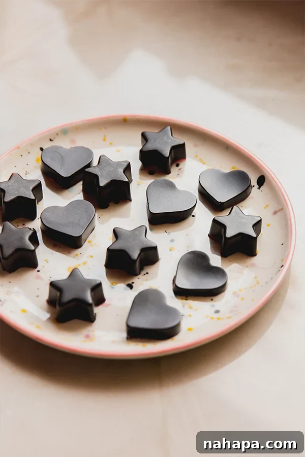 A plate full of elderberry syrup gummies sitting on a counter.