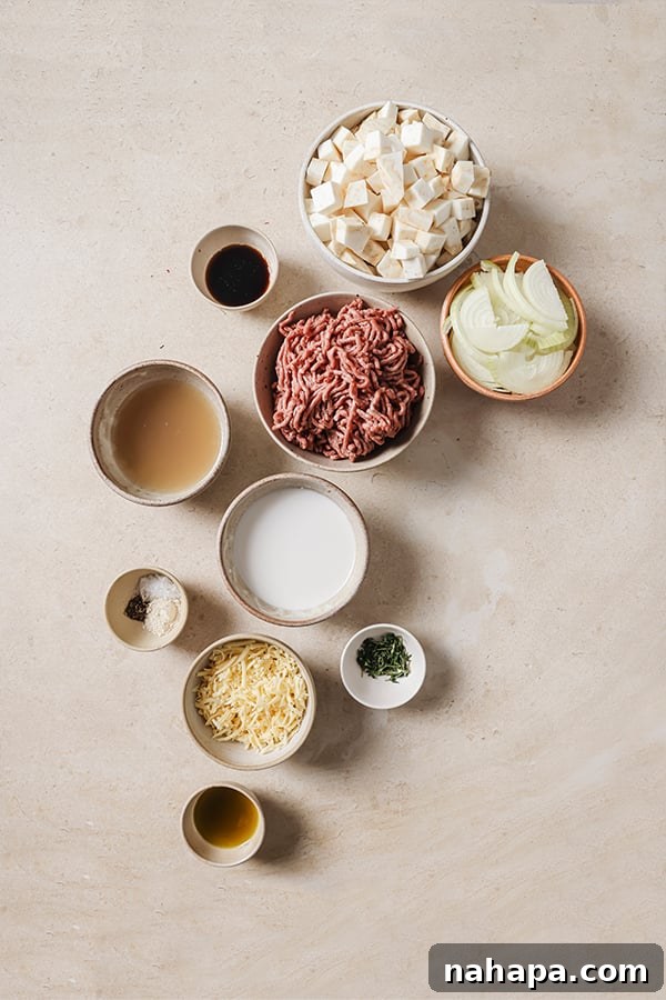 All the fresh ingredients for French onion shepherd's pie laid out on a kitchen counter, neatly arranged and ready for preparation.