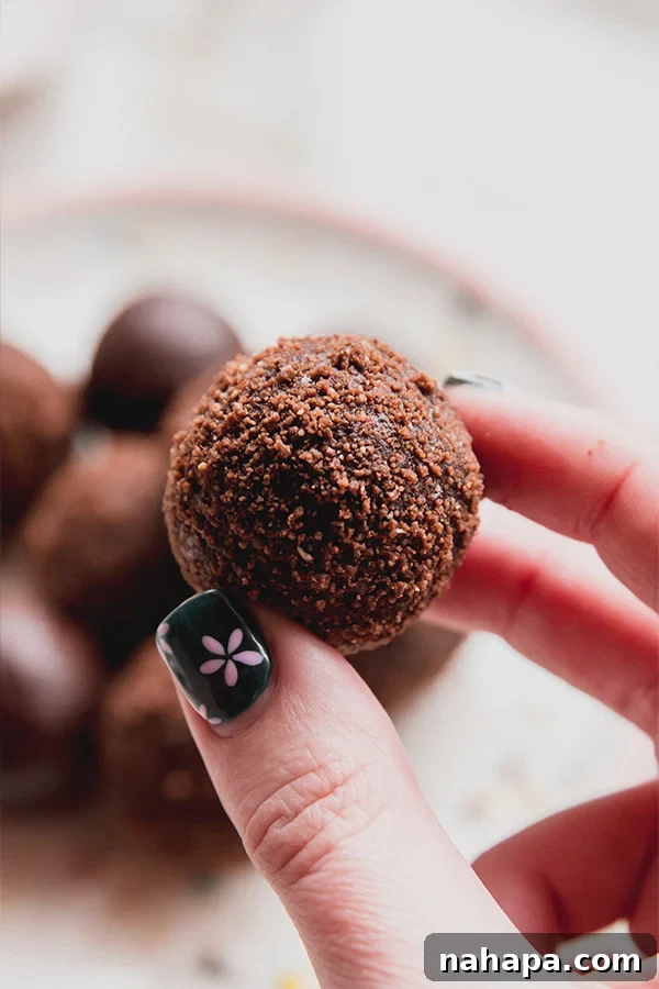 One thin mint truffle being held in a hand.