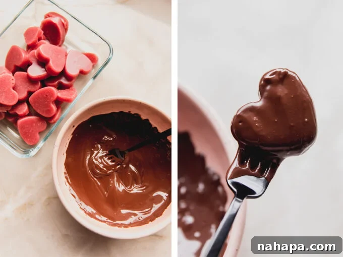 Chocolate dipped strawberry gummies on parchment paper