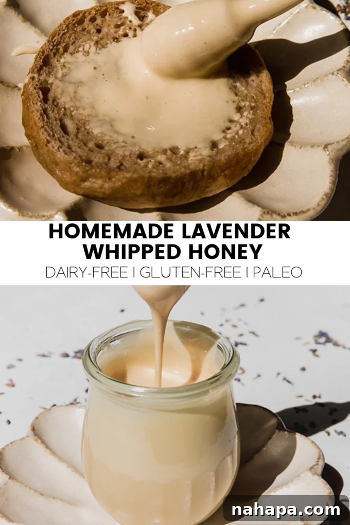 A stunning close-up of a jar filled with creamy Homemade Lavender Whipped Honey, garnished with fresh lavender sprigs.