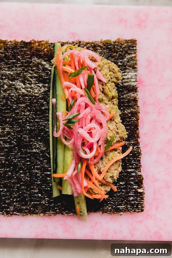 A tuna salad seaweed wrap after putting it together before rolling it.
