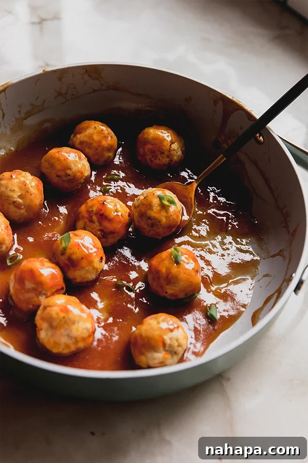 Irresistible Sweet and Sour Chicken Bites Gluten Free 4 A pan with the sweet & sour chicken meatballs after cooking.
