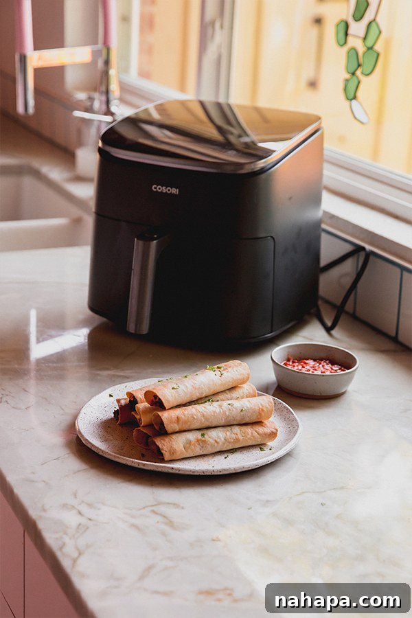 Wholesome Gluten-Free Veggie Pizza Bites 3 A cutting board filled with crispy Air Fryer Veggie Pizza Roll-Ups, garnished and ready to be served.