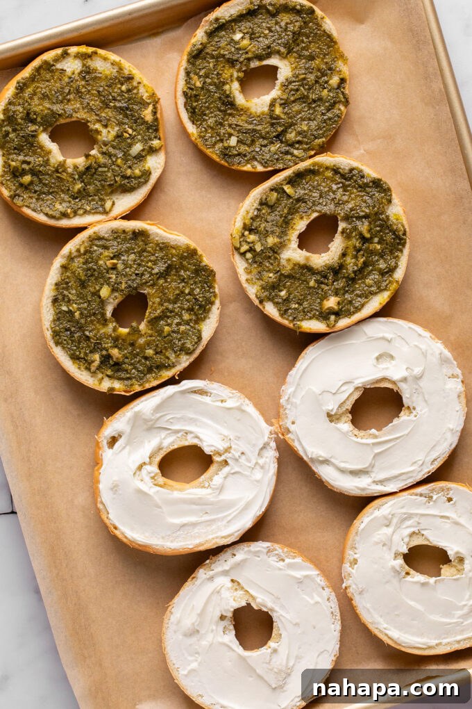 Spreading cream cheese on a bagel