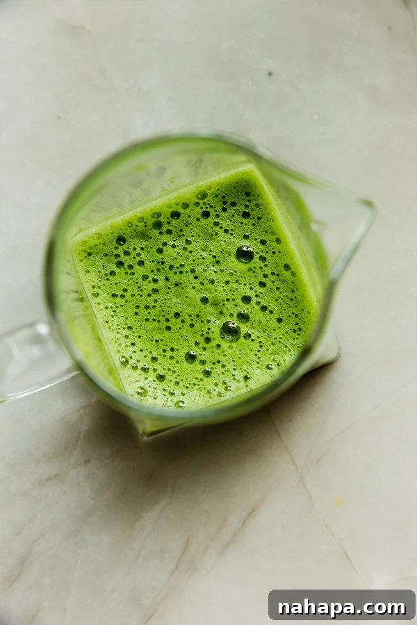 Jade Piña Paradise 4 Matcha Piña Colada ingredients being blended in a blender