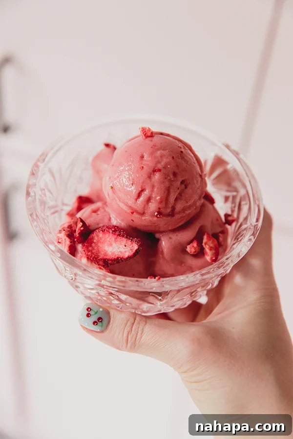 Strawberry Pink Drink Sorbet in a bowl, a Ninja Creami recipe.