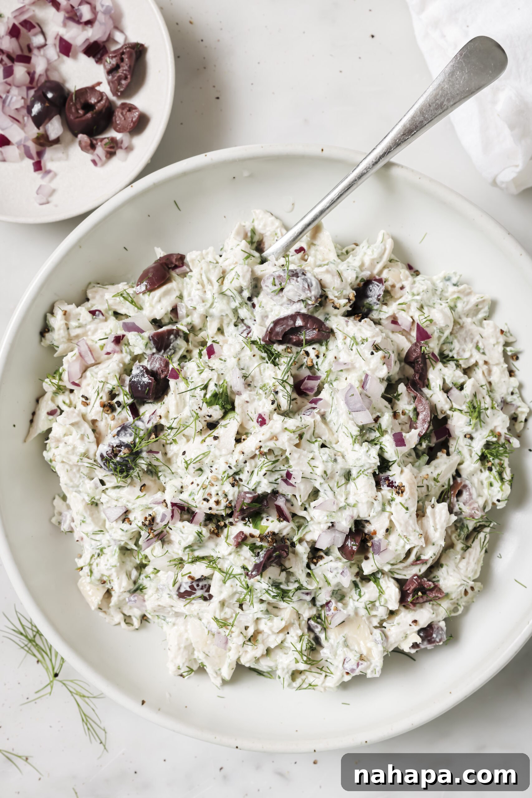 Tzatziki Chicken Salad garnished with fresh dill.