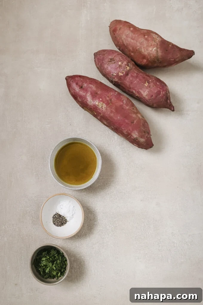 A close-up view of raw Japanese sweet potatoes sliced into uniform fry shapes, arranged neatly before cooking.