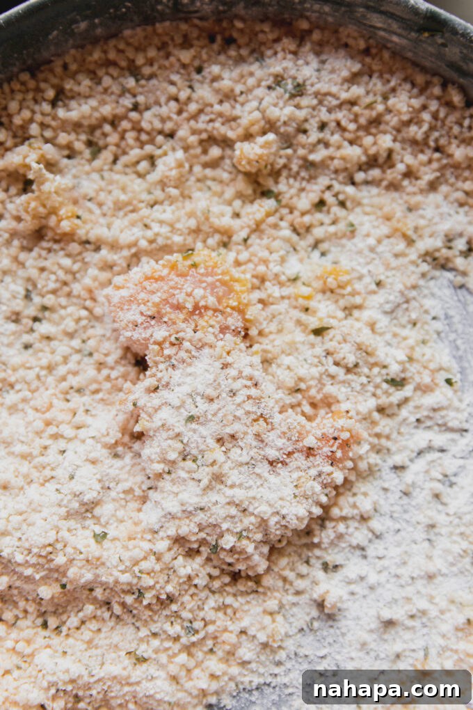 Dino-shaped nugget in bread crumbs.