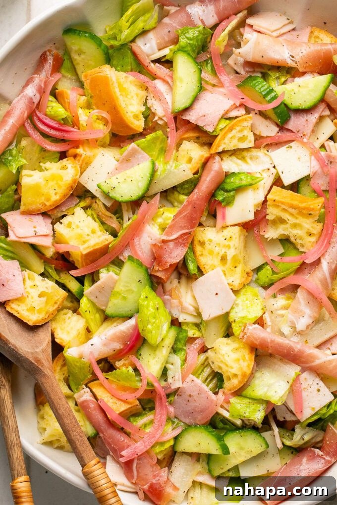 Gluten-Free Sub Salad Bowl 2 A close up photo of the finished sub in a tub salad, showcasing fresh ingredients.