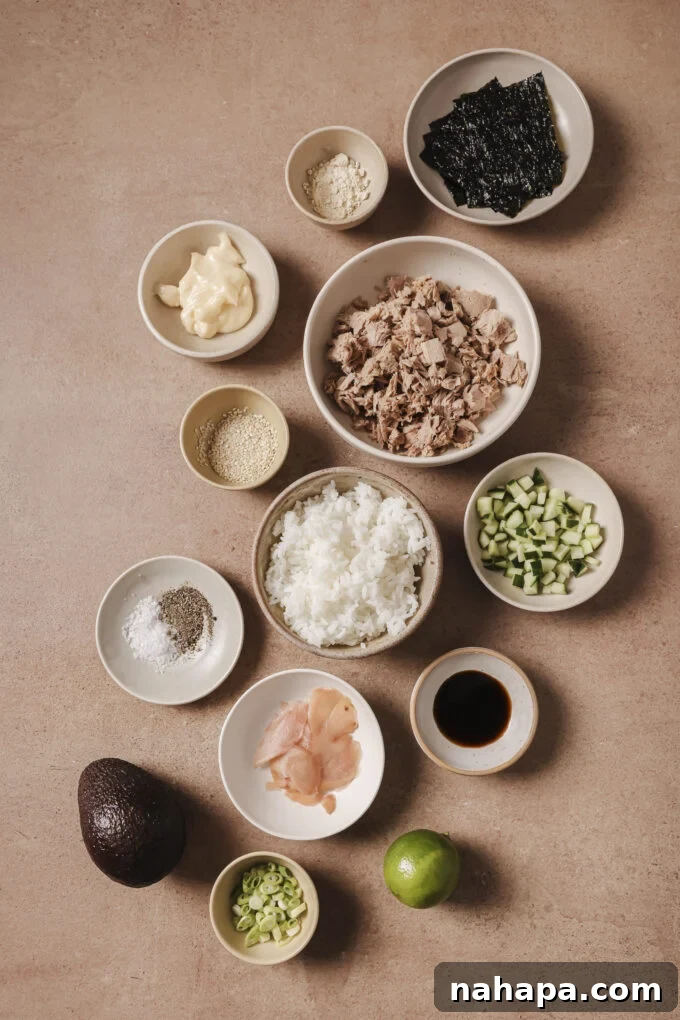 Avocado tuna rice bowl ingredients in separate bowls.