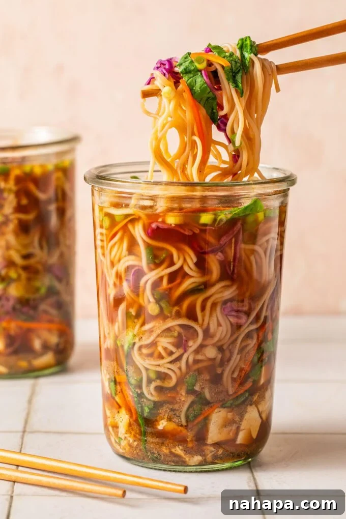 Elevated Gluten-Free Noodle Cups: Healthy Homemade Comfort 2 Two instant cup of noodles, one with chopsticks pulling up the ramen.