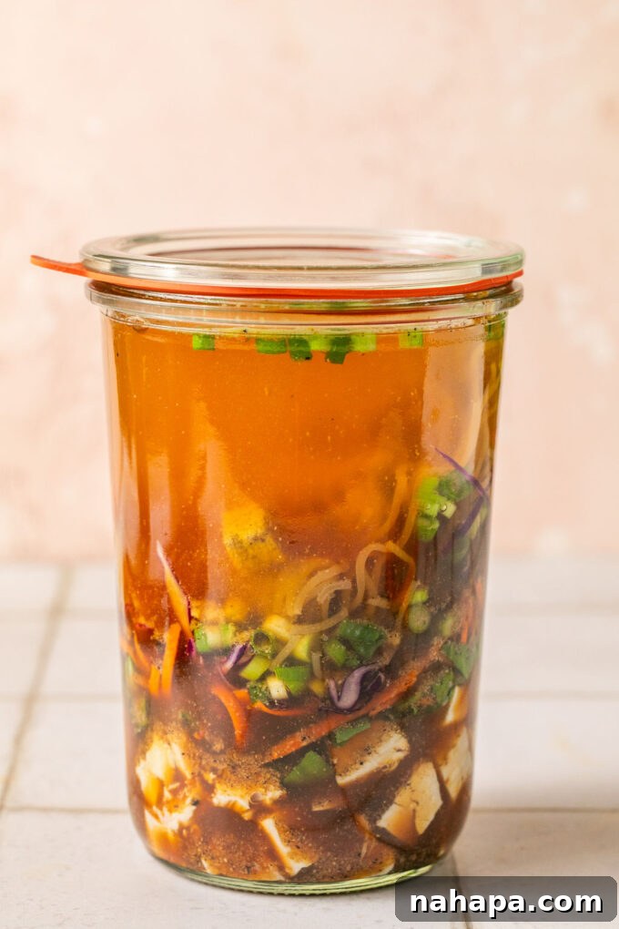 Elevated Gluten-Free Noodle Cups: Healthy Homemade Comfort 9 Cooked chicken, veggies, green onion, a brick of gluten free ramen layered in a glass jar with hot water/