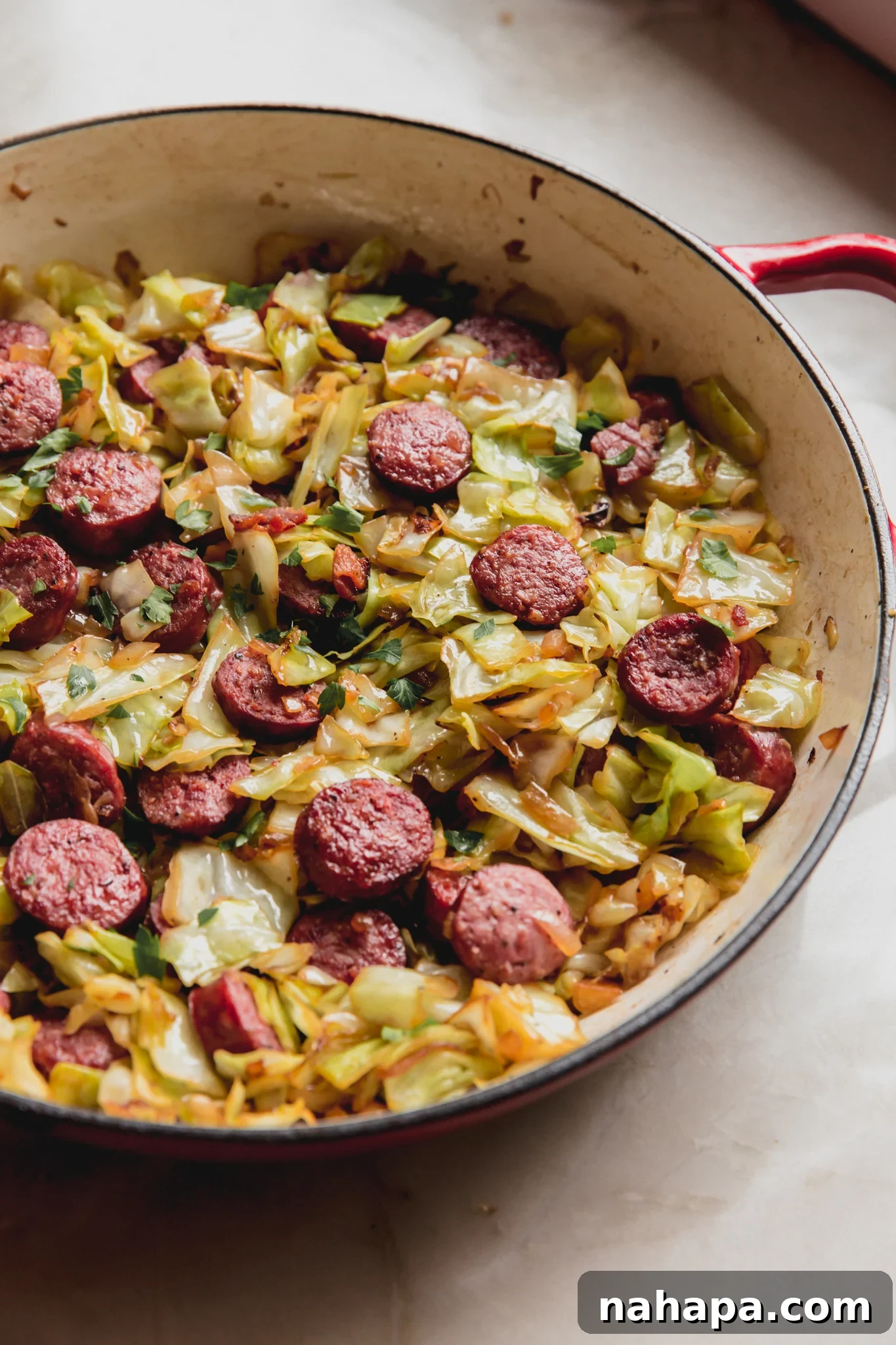 Down-Home Skillet Cabbage and Sausage 2 Southern cabbage and sausage in a large skillet, ready to serve.