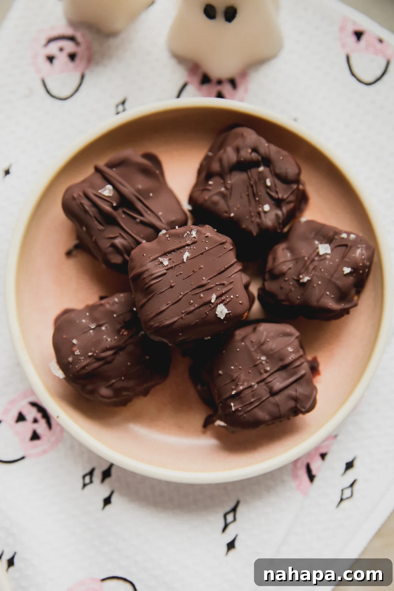 Copycat butterfinger minis on a pink plate.