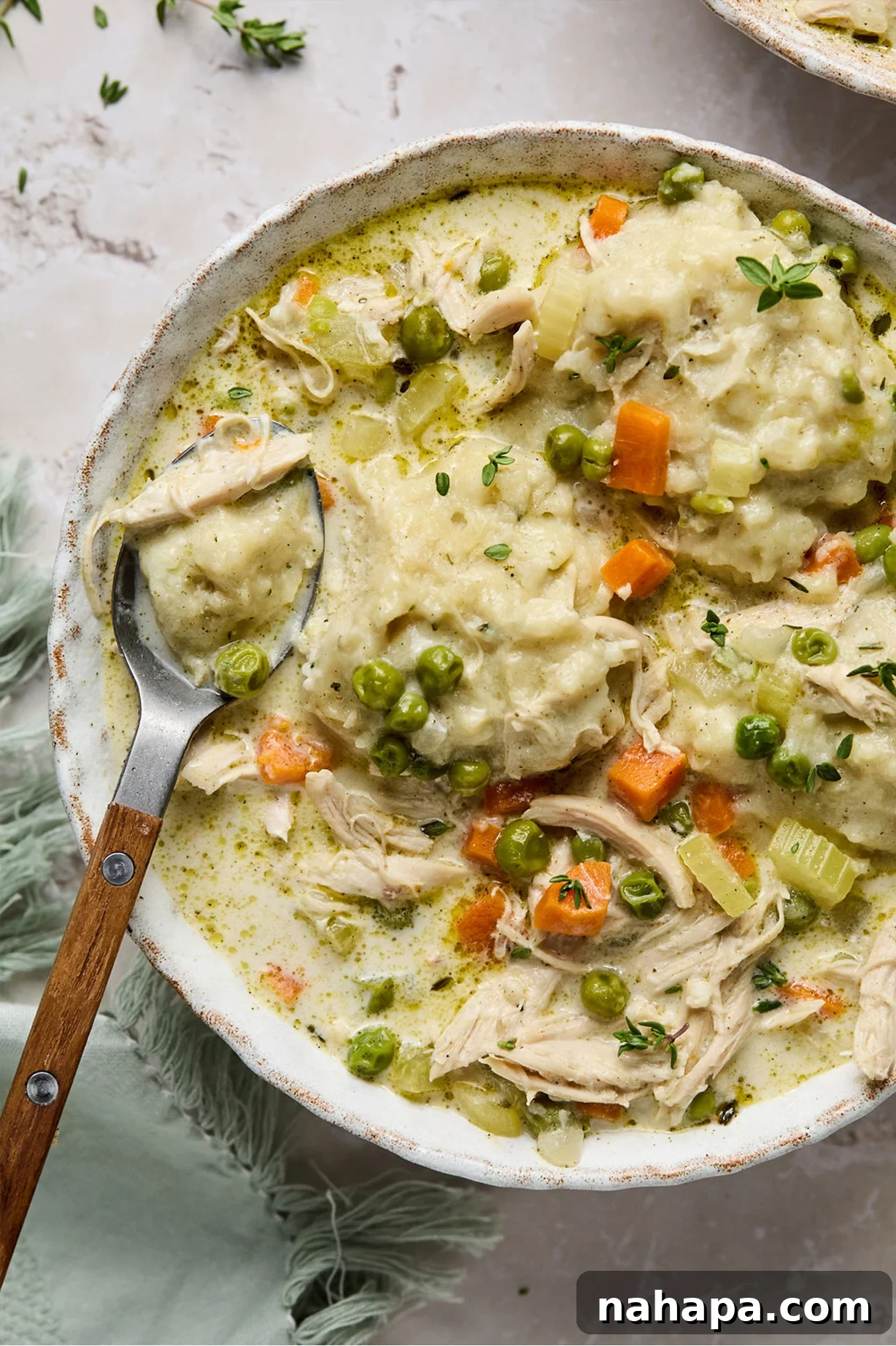 Hearty gluten-free chicken and dumplings in a bowl, perfect for a cozy meal.