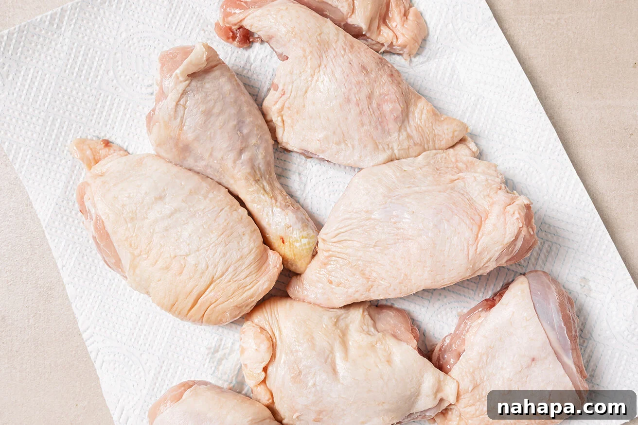 Raw turkey wings on a paper towel.