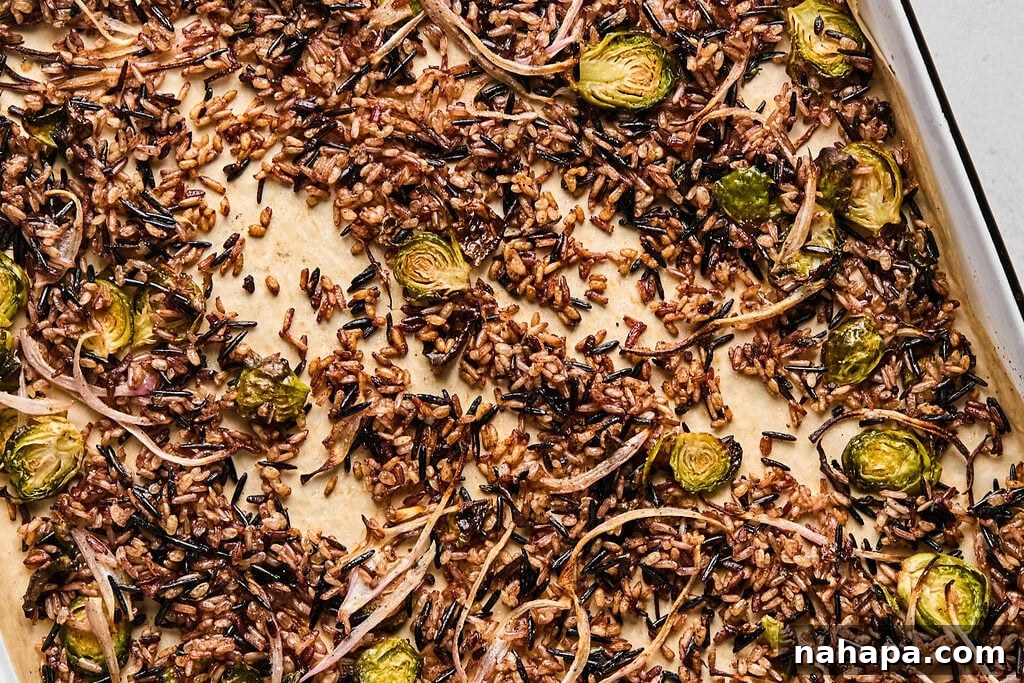 Cooked wild rice, shredded brussels, shallots, and spices  mixed well on a baking sheet and baked through.