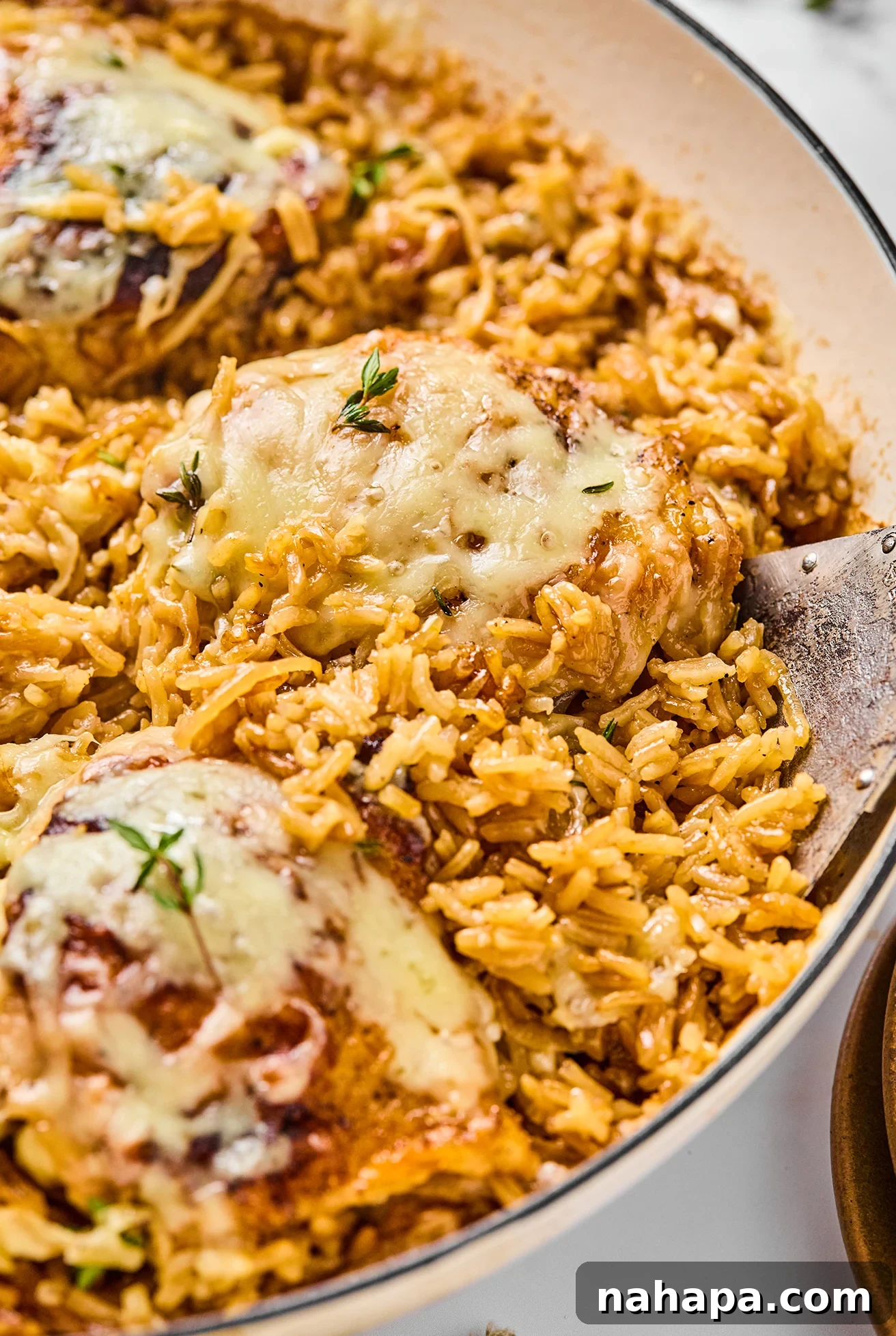 French onion chicken and rice in a large pan.