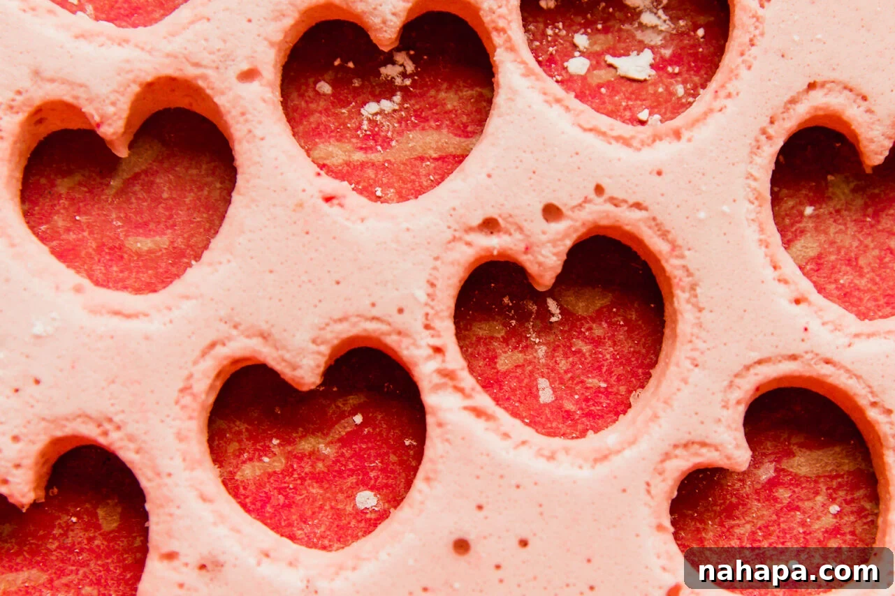 Sweet Pink Cloud Bites 7 Pink marshmallow with several small heart cut outs.