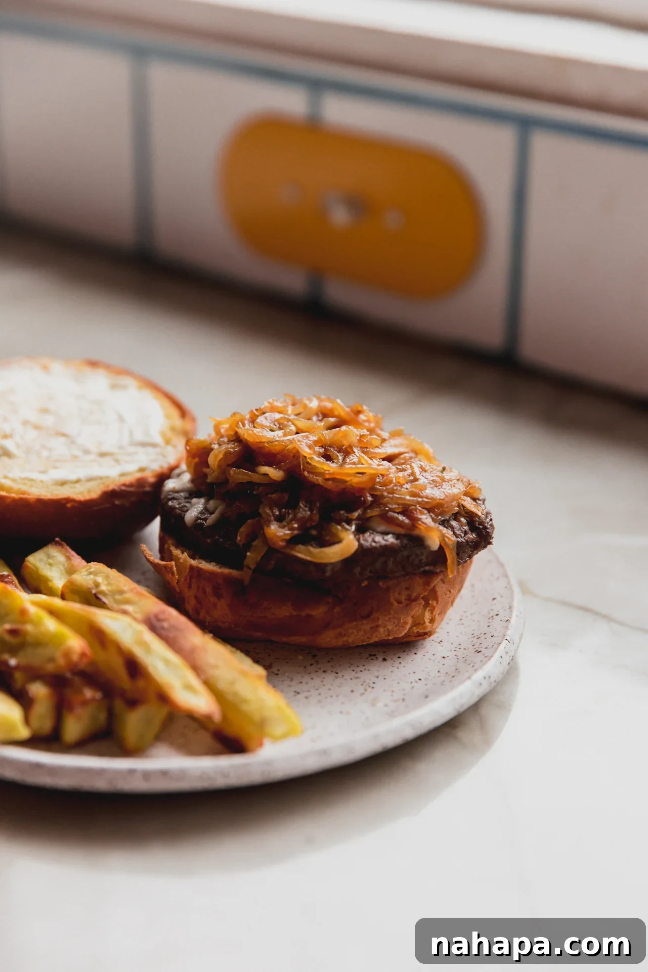 French onion burger served with fries.