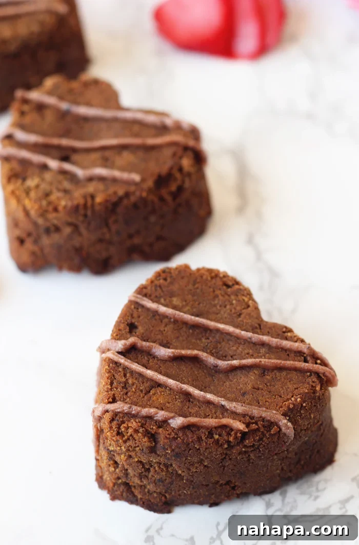 AIP Valentine's Brownies Guilt-Free Love Bites 4 AIP Brownies in heart shapes with icing.