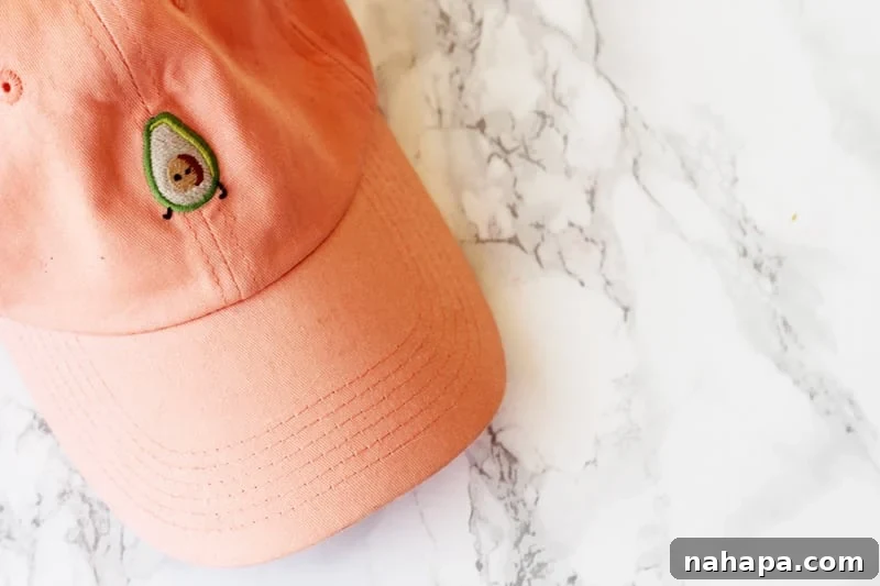 January Wellness Picks 5 A vibrant orange hat adorned with a playful avocado design.