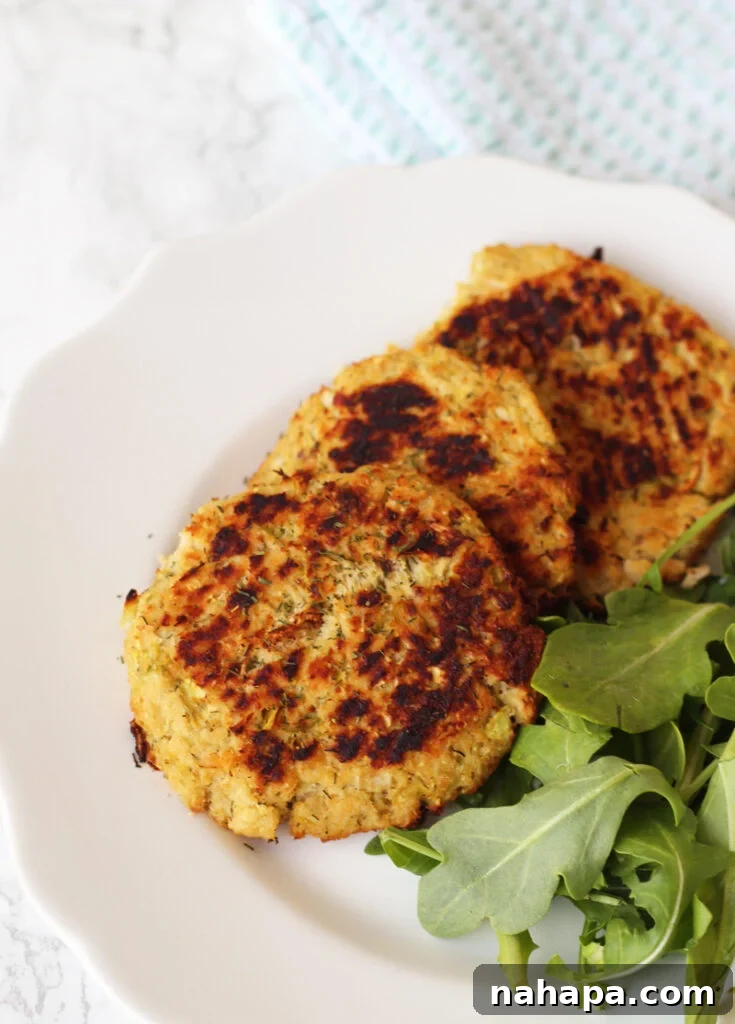 Breaking the Gut Healing Stalemate: What You're Missing 4 A plate with three salmon patties and arugula ready to be eaten.