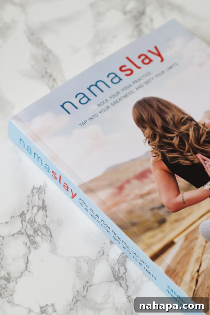 A book titled 'Namaslay' resting on a kitchen counter.