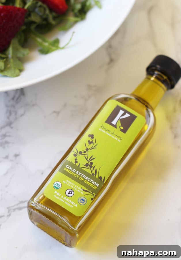 A pristine bottle of Kasandrino’s International Olive Oil resting on a kitchen counter.