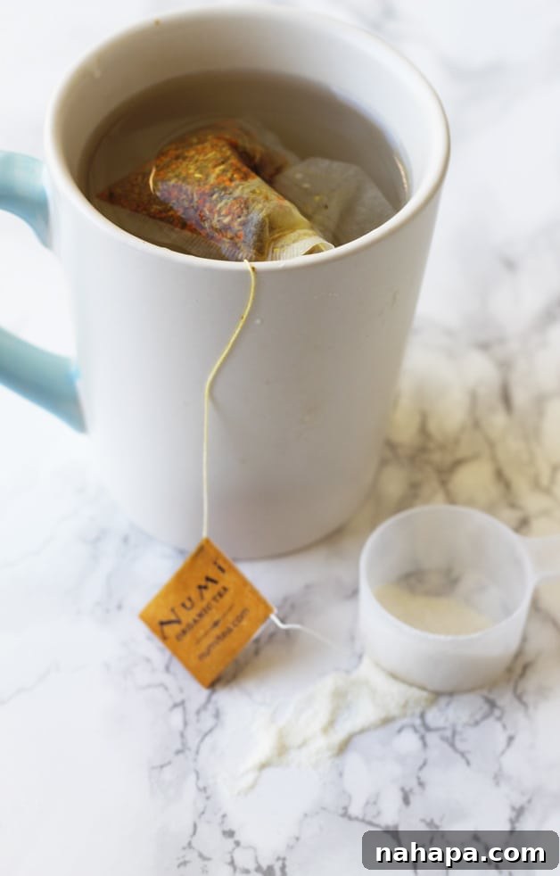 A comforting mug of organic turmeric tea, with a serving of Vital Proteins Collagen conveniently placed beside it.