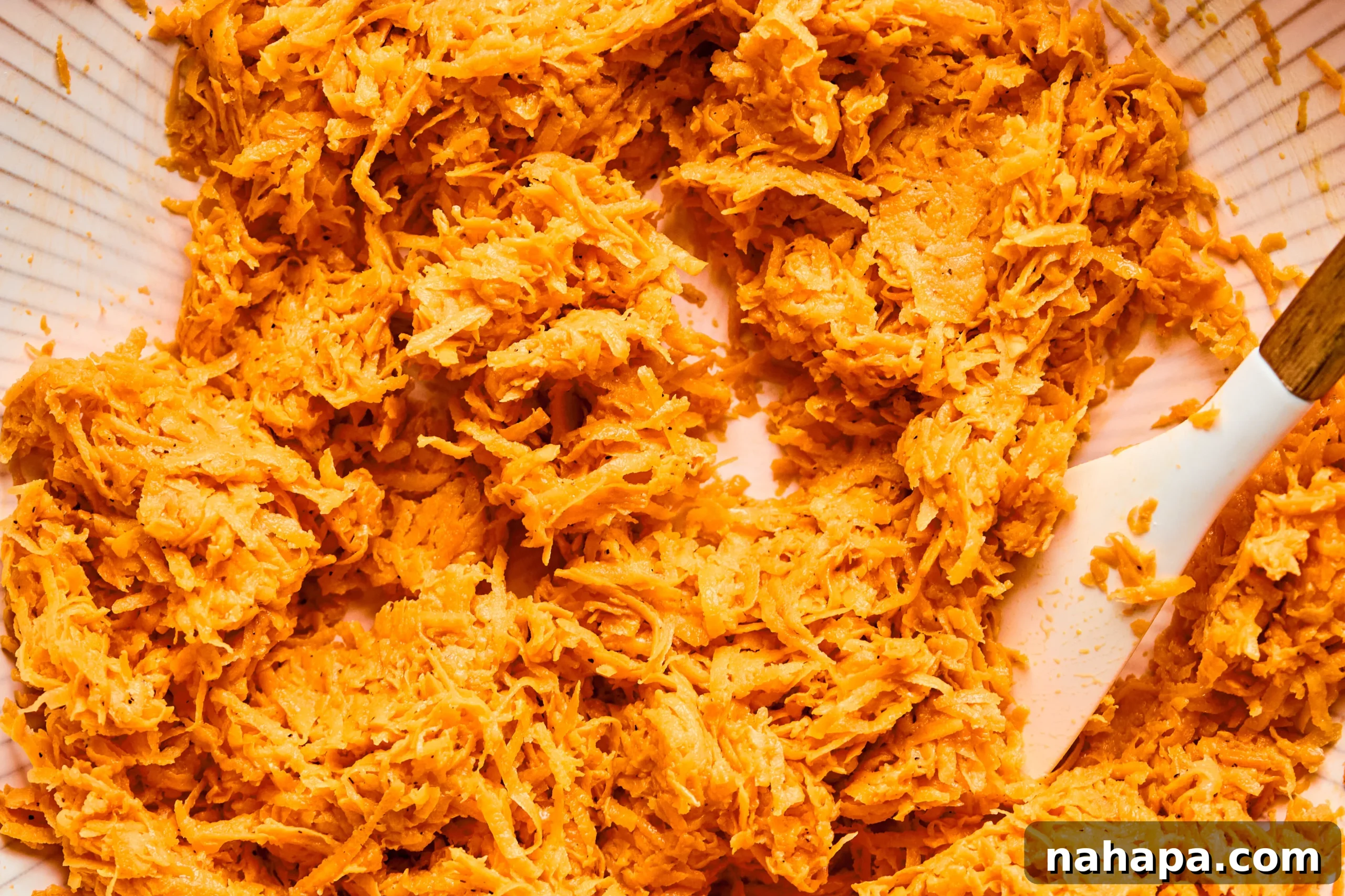 Shredded sweet potato mixed with other ingredients to make the crust.